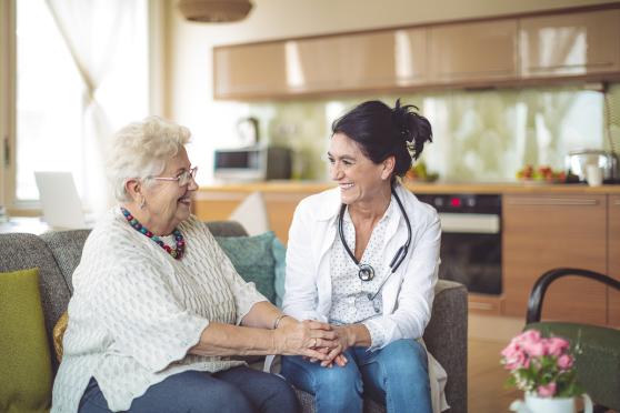 Home healthcare worker visiting patient at home